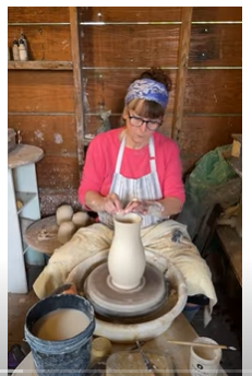 Lori Watts throwing clay on potters wheel